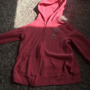 A pink jacket that has been worn once